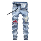 Light-colored stretch ripped jeans